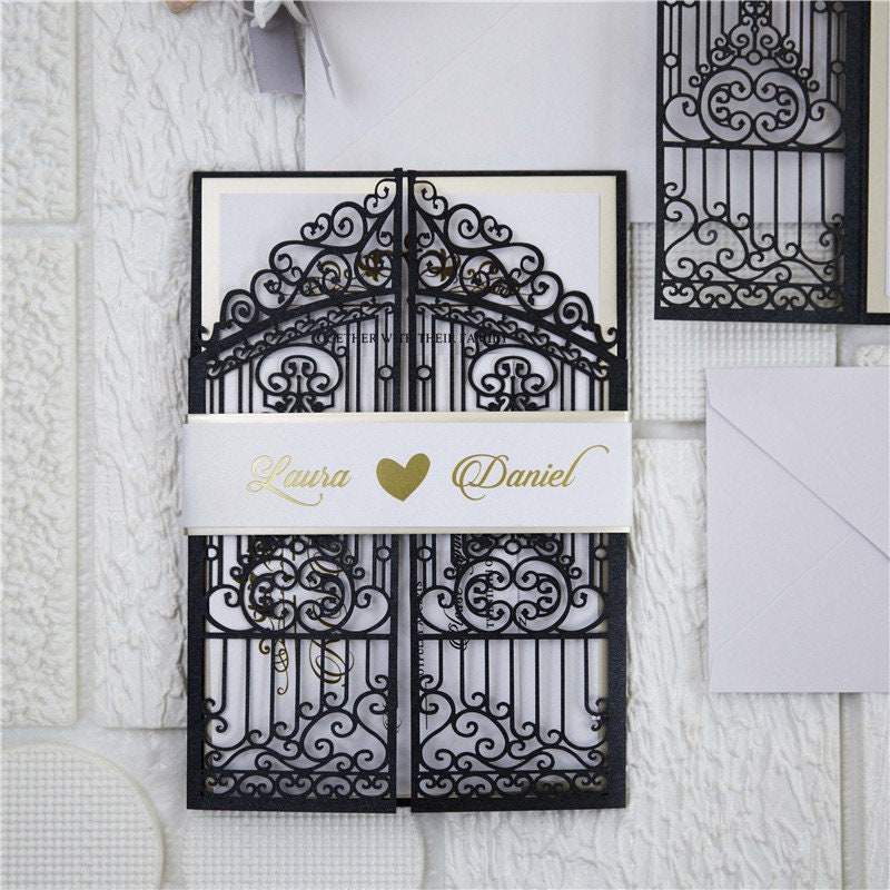 Iron Gate Lasercut Wedding Invite in Black Shimmer, with gold foiled belly band