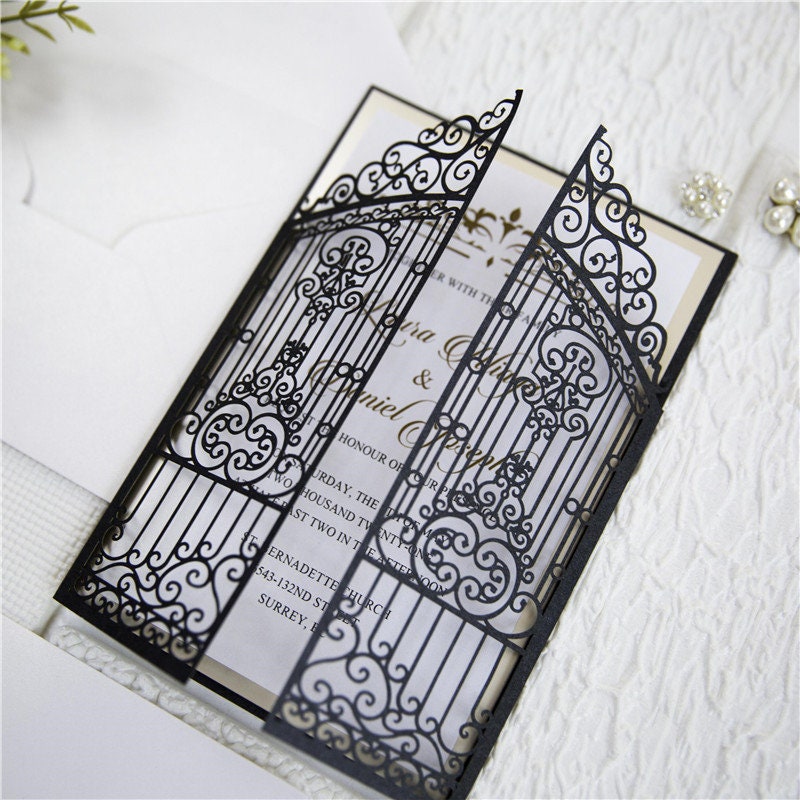 Iron Gate Lasercut Wedding Invite in Black Shimmer, with gold foiled belly band