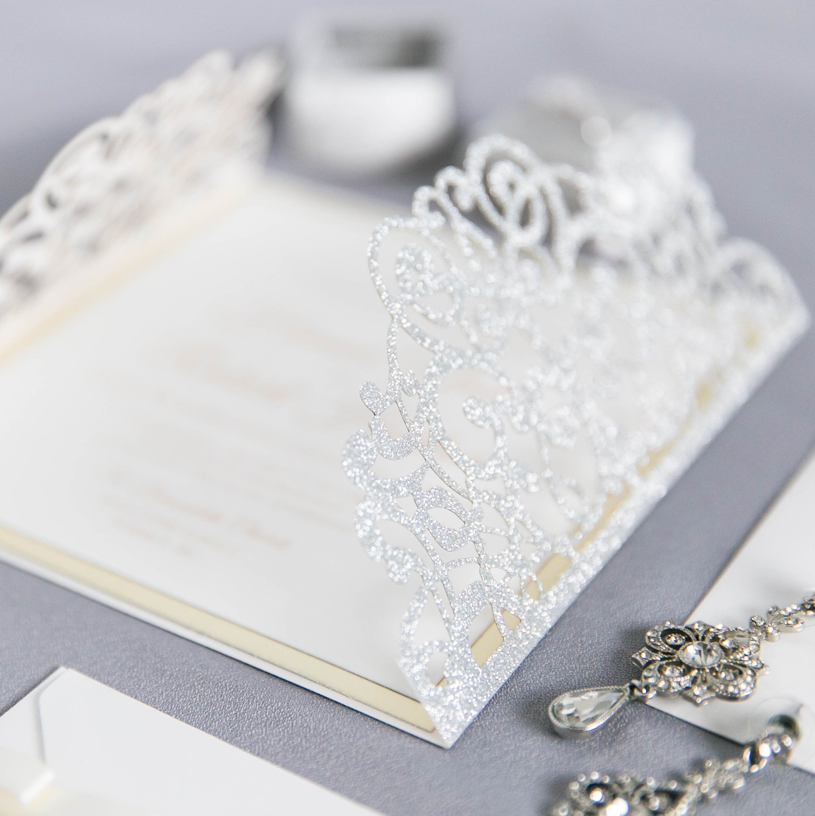 Silver Glitter Gatefold Lasercut Wedding Invitation with Diamanté Detail Embellishment & Ivory Ribbon