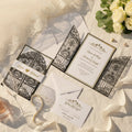 Iron Gate Lasercut Wedding Invite in Black Shimmer, with gold foiled belly band
