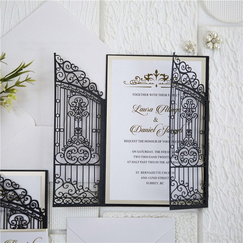 Iron Gate Lasercut Wedding Invite in Black Shimmer, with gold foiled belly band